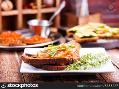 bread with red salmon on the plate