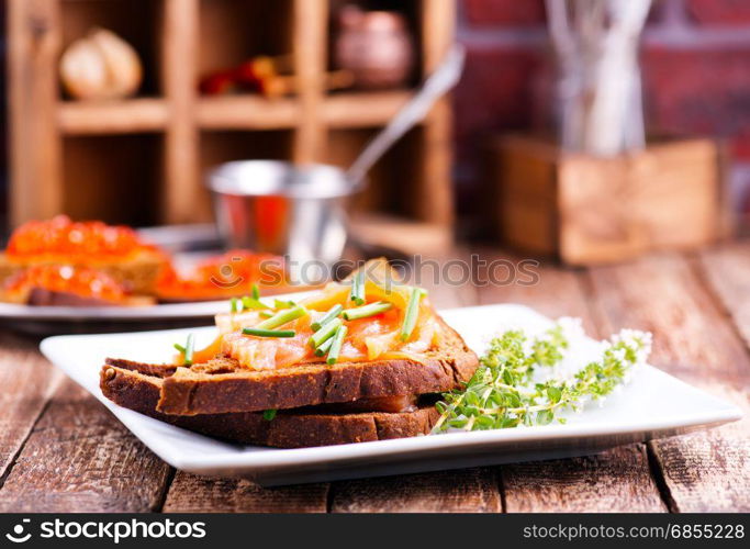 bread with red salmon on the plate