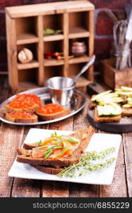 bread with red salmon on the plate