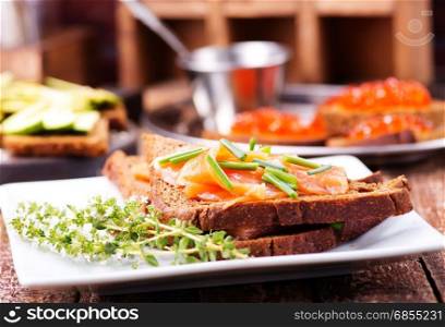 bread with red salmon on the plate