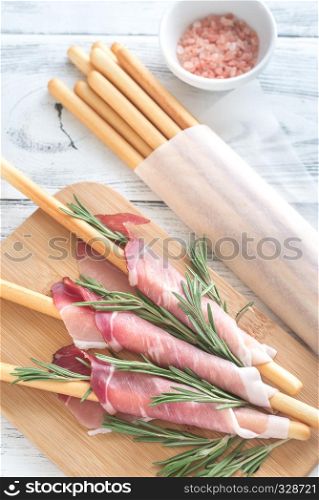 Breadsticks wrapped in ham