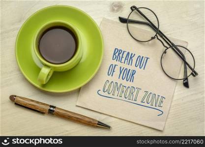 break out of your comfort zone concept - motivational handwriting on a napkin with a cup of coffee, challenge, motivation and personal development