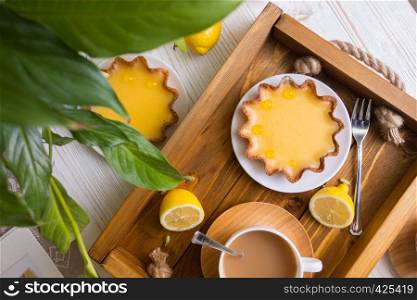 Breakfast - a tray of lemon tarts and coffee