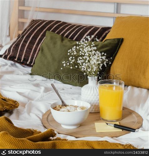 breakfast bed with juice glass