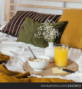 breakfast bed with juice glass