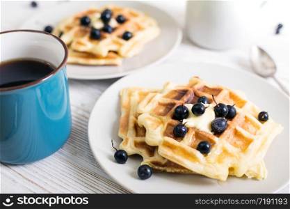 breakfast - Belgian waffles with Jostaberry and cup with tea