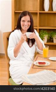 Breakfast coffee and toast happy woman in home bathrobe