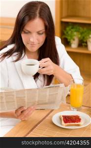 Breakfast coffee and toast happy woman read newspapers at home
