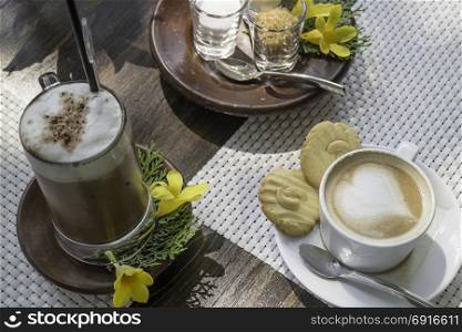 Breakfast coffee on balcony wooden table, stock photo