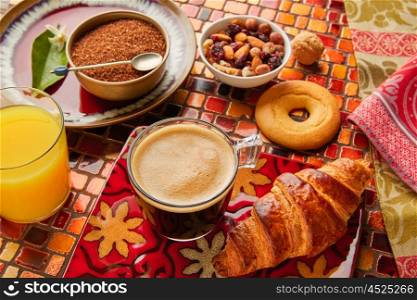 Breakfast continental with croissant coffe and orange juice