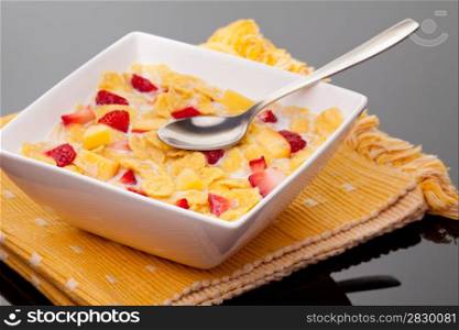breakfast. cornflakes with milk and strawberries