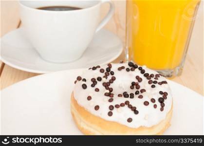 Breakfast - Donut, Coffee and Orange Juice on Wooden Table