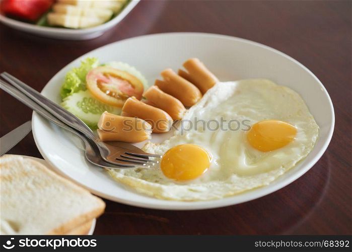 breakfast (fried egg and hot dog and bread) in the hotel