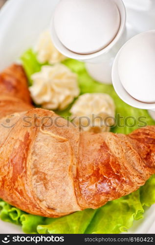 breakfast from eggs and croissant. Tasty breakfast from eggs and croissant