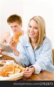 Breakfast happy couple enjoy romantic morning eat croissant