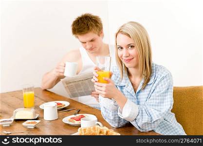 Breakfast happy couple enjoying fresh morning, focus on woman