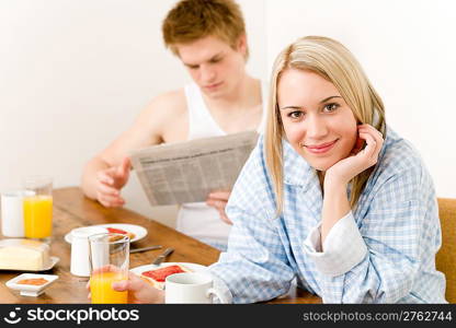 Breakfast happy couple enjoying romantic morning, focus on woman