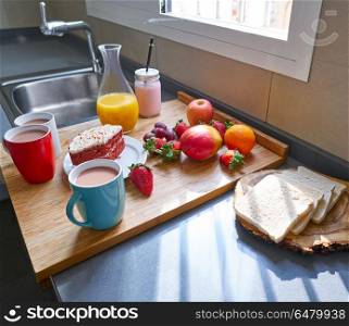 Breakfast in kitchen with coffee bread fruit juice. Breakfast in kitchen with coffee bread fruit juice and cake