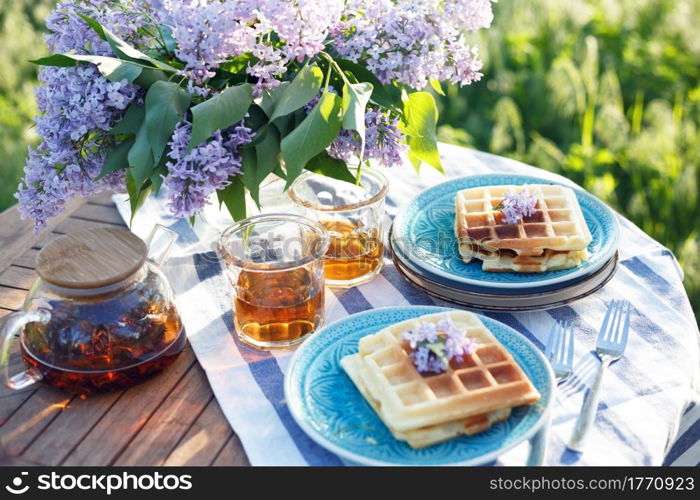 breakfast in the garden - Belgian waffles and cup with tea