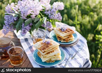 breakfast in the garden - Belgian waffles and cup with tea
