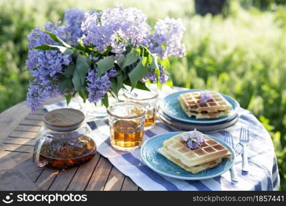 breakfast in the garden - Belgian waffles and cup with tea