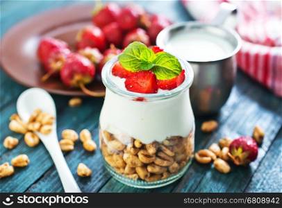 breakfast on a table, yogurt with flakes and berries