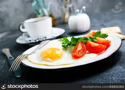 breakfast on plate, fried eggs with vegetables