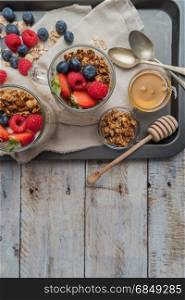 Breakfast parfait with homemade granola, fresh fruits and yogurt