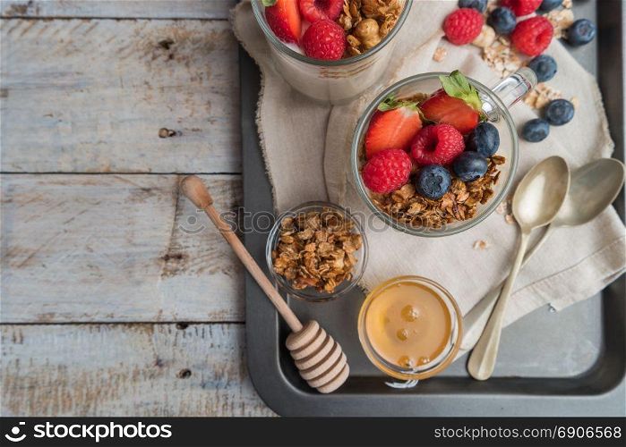 Breakfast parfait with homemade granola, fresh fruits and yogurt