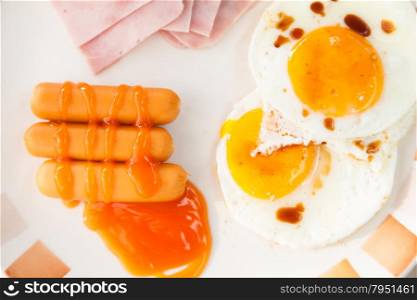 Breakfast. Sausage, ham and eggs. Supplied in a large dish for breakfast.