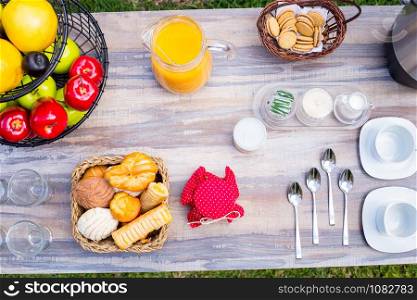 Breakfast served with coffee, juice, croissants and fruits.