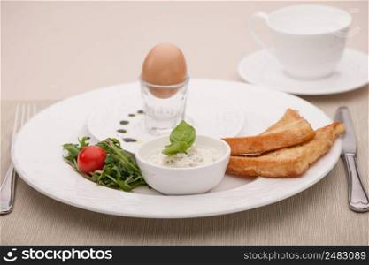 breakfast served with fried bread and egg and curd. breakfast served with toast and fried bread