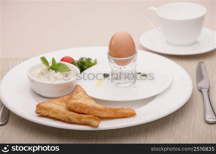 breakfast served with fried bread and egg and curd. breakfast served with toast and fried bread