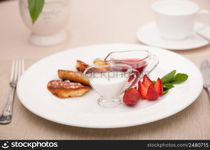 breakfast served with toast with strawberries and milk. breakfast served with toast and fried bread