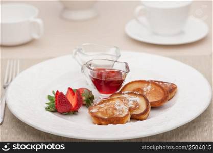 breakfast served with toast with strawberries and milk. breakfast served with toast and fried bread