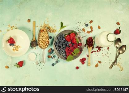 Breakfast set with granola, almond milk, superfoods and berries. Morning food, Diet, Detox, Clean Eating, Vegetarian concept.