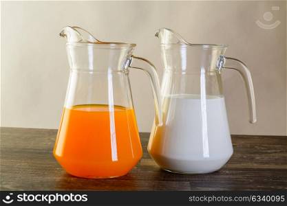 breakfast two jars one with orange juice and the other with milk studio iluminated