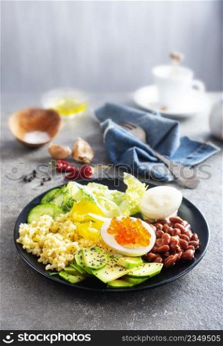 breakfast, wheat porridge with boiled egg and fresh vegetables