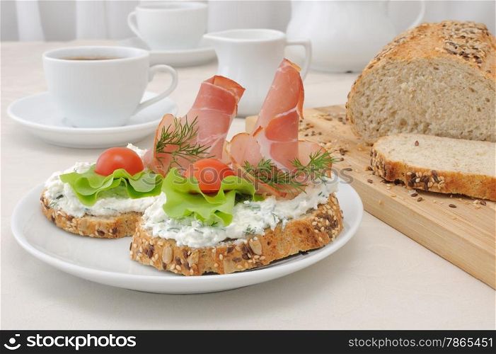 breakfast with a cup of coffee and a sandwich of whole grain bread with ricotta and ham&#xA;&#xA;
