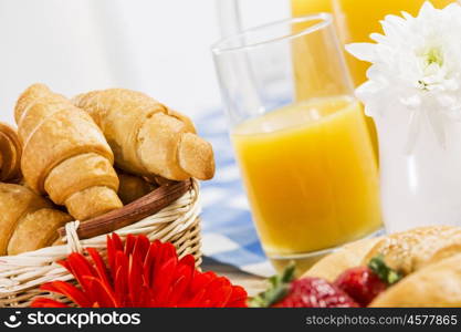 Breakfast with assortment of pastries, coffees and fresh strawberries