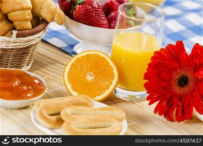Breakfast with assortment of pastries, coffees and fresh strawberries