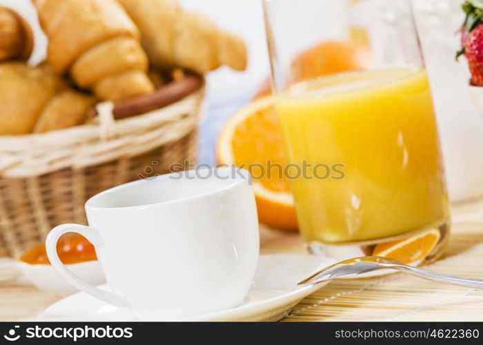 Breakfast with assortment of pastries, coffees and fresh strawberries