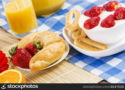 Breakfast with assortment of pastries, coffees and fresh strawberries