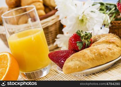 Breakfast with assortment of pastries, coffees and fresh strawberries