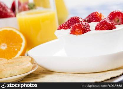 Breakfast with assortment of pastries, coffees and fresh strawberries