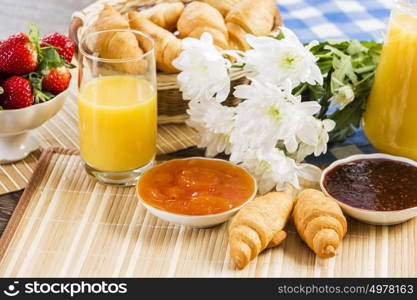 Breakfast with assortment of pastries, coffees and fresh strawberries