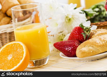 Breakfast with assortment of pastries, coffees and fresh strawberries