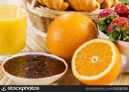 Breakfast with assortment of pastries, coffees and fresh strawberries