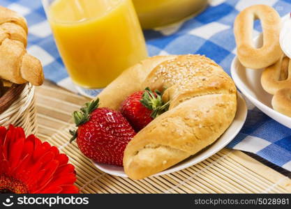 Breakfast with assortment of pastries, coffees and fresh strawberries