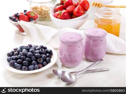 breakfast with blueberry yogurt with fresh fruits
